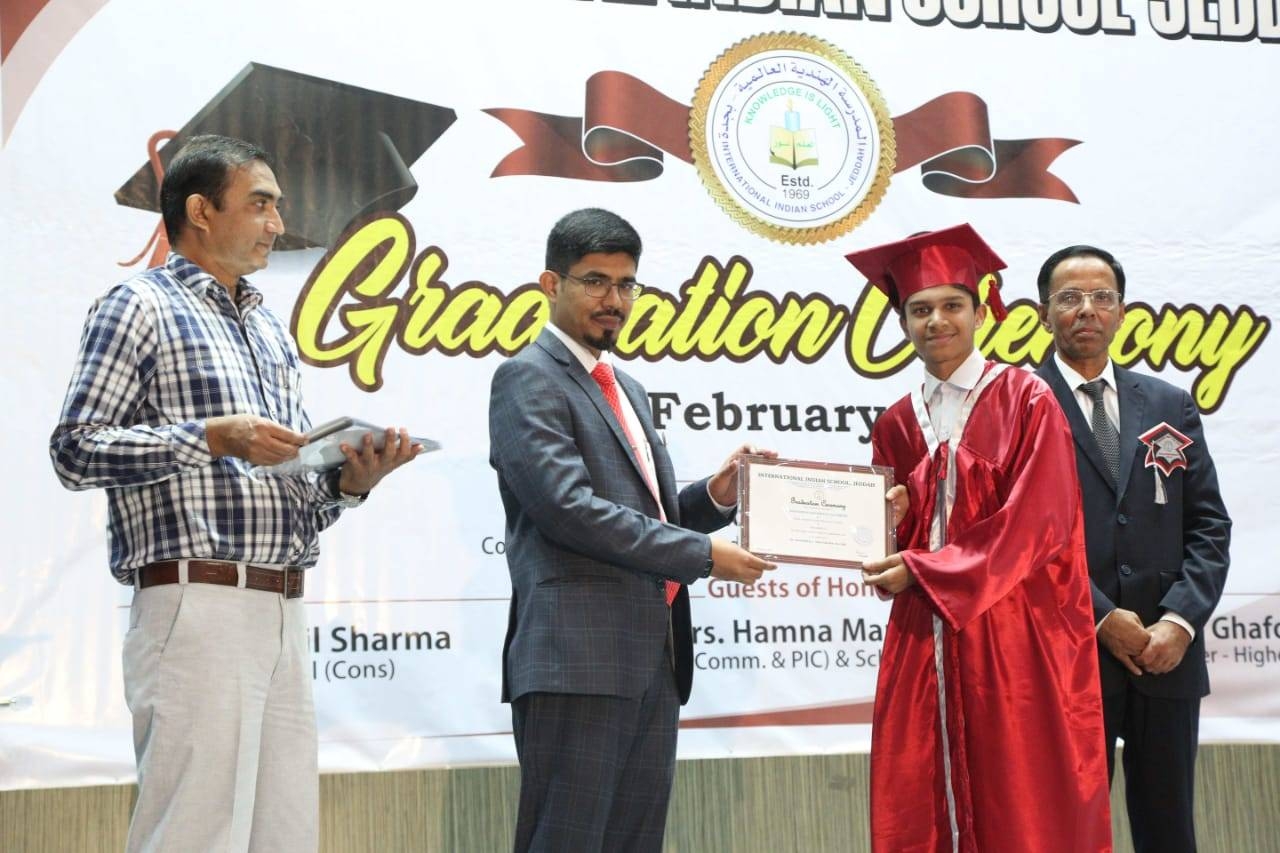 Indian Consul General Mohammed Noor Rahman Sheikh presenting certificate to a graduate as Principal Dr. Muzaffar Hassan looks on. — SG photos