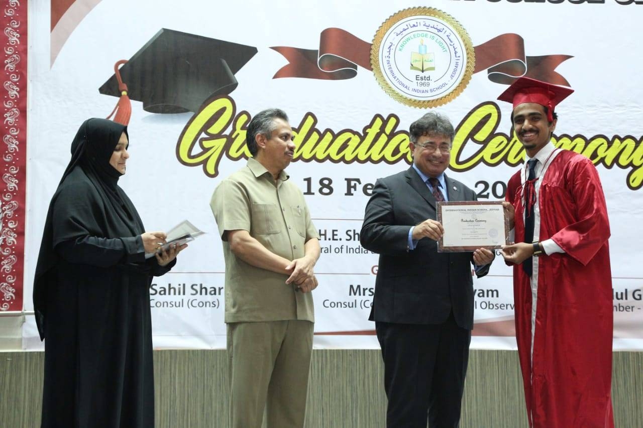 Indian Consul General Mohammed Noor Rahman Sheikh presenting certificate to a graduate as Principal Dr. Muzaffar Hassan looks on. — SG photos