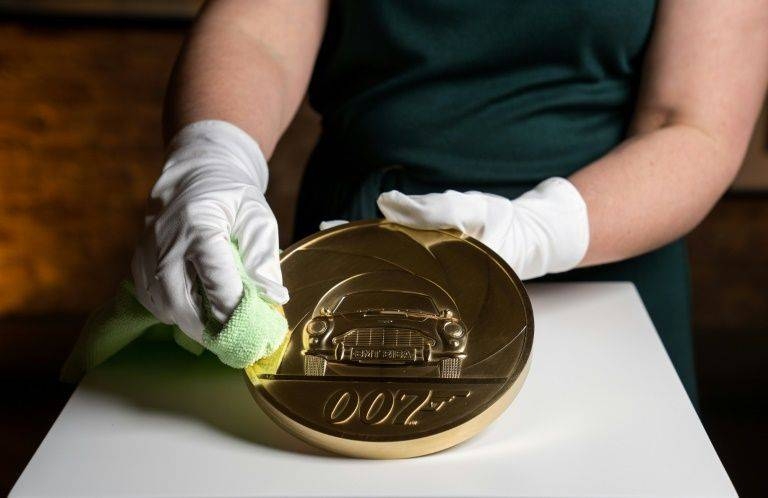 The piece is engraved with an image of the fictional British spy's favorite car, an Aston Martin DB5. — AFP