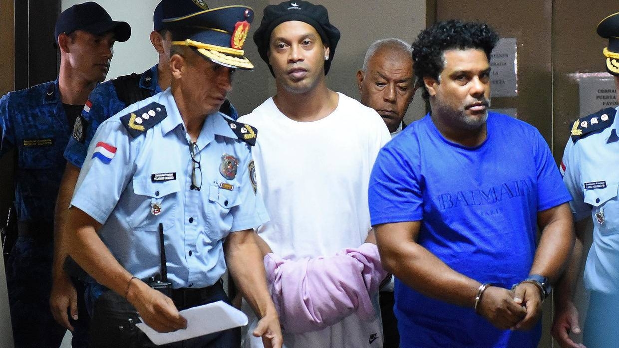 Brazilian football legend Ronaldinho was behind bars on Saturday after being arrested for entering Paraguay on a fake passport, a judge in Asuncion confirmed on Saturday. — AFP