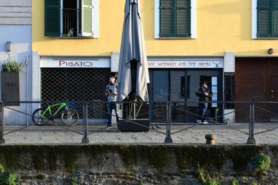 All restaurants and bars across Italy have to shut by evening and can only offer home deliveries. — AFP