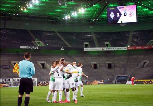 Borussia Moenchengladbach beat Cologne 2-1 on Wednesday to move back into the Bundesliga top four in the first game in German top-flight history to be played behind closed doors, due to the coronavirus pandemic.