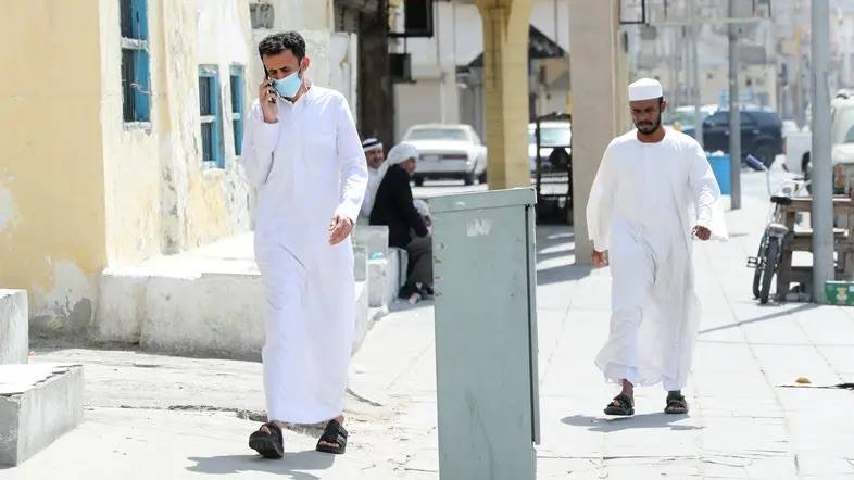 A man walks wearing a protective face mask after Saudi Arabia imposed a temporary lockdown on the province of Qatif on March 10. — Courtesy photo