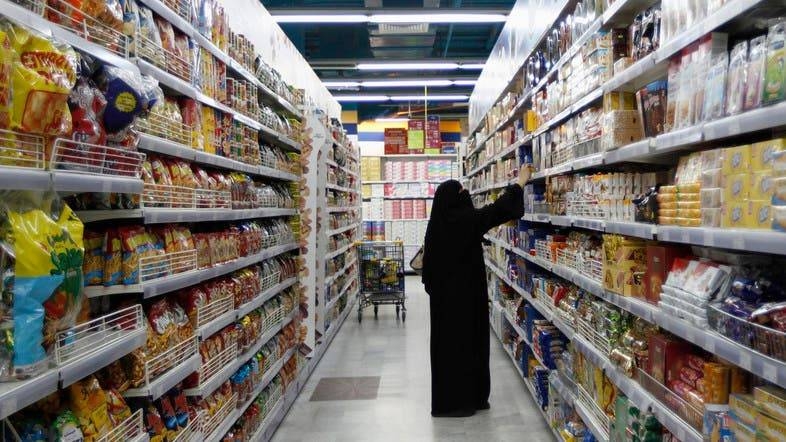 A woman looks at products as she buys food supplies at a supermarket in Dubai. ‑‑ Courtesy photo
