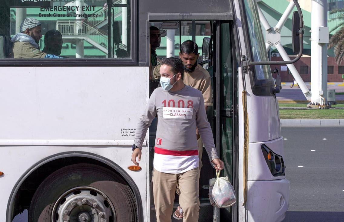 A worker with a face mask disembarks from a bus in Abu Dhabi in this March 5, 2020 file picture. — Courtesy photo