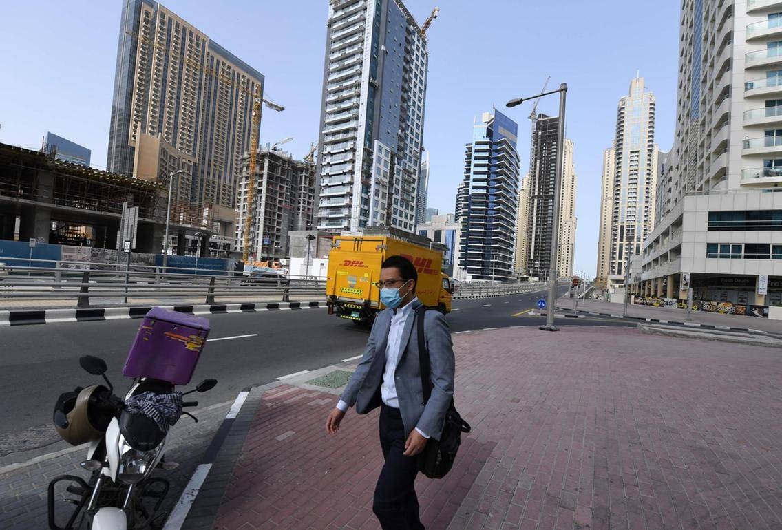 People walk past shops in Dubai's Deira Souk in this March 15, 2020 file photo. — Courtesy photo