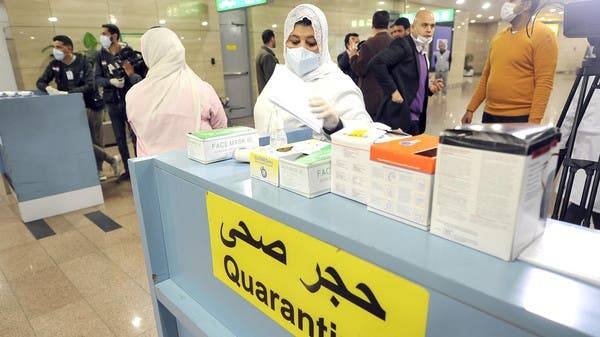 Egyptian Quarantine Authority employees prepare to scan body temperature for incoming travelers at Cairo International Airport to detect coronavirus. ‑‑ Courtesy photo