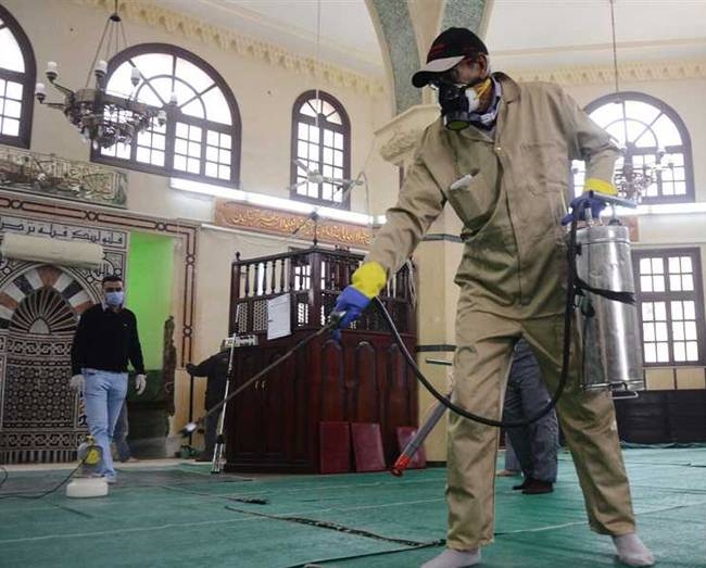 The floor of a mosque in Egypt is being sterilized. Egypt has shut down its mosques for two weeks due to the new coronavirus.