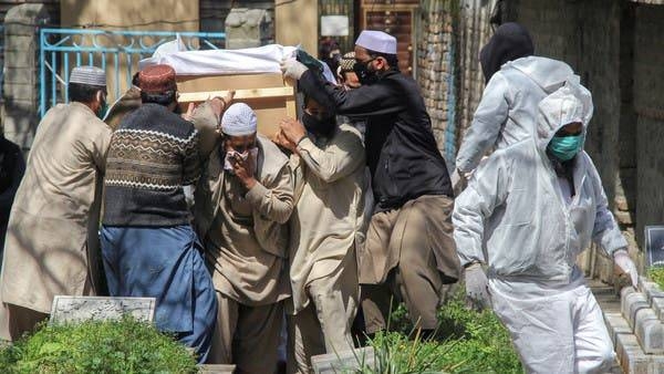 People move a coffin of a man who died due to coronavirus disease (COVID-19), for a burial at graveyard in Abbottabad, Pakistan, in this file picture. — Courtesy photo
