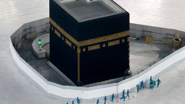 Workers disinfect the ground around the Ka'ba, the cubic building at the Grand Mosque, in the holy city of Makkah. — Courtesy photo