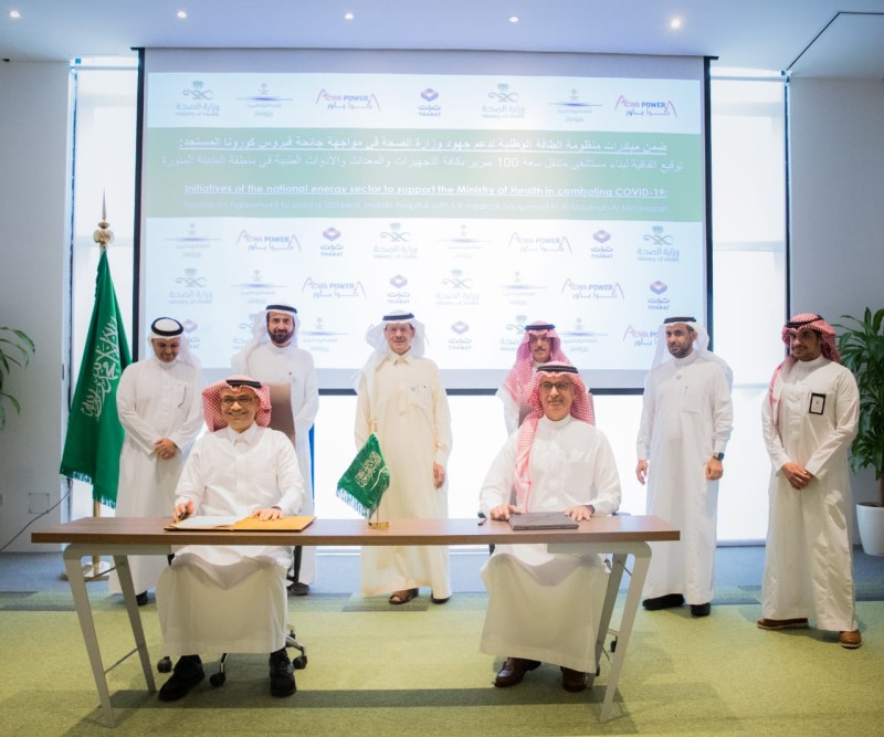 Prince Abdulaziz Bin Salman, minister of energy; ​​​​Dr. Tawfiq Al-Rabiah, minister of health; and Mohammad Abunayyan, chairman of ACWA Power, are seen at the signing of the agreement in Riyadh. The signing was executed by Thamer Al Sharhan, representing ACWA Power, and Essam Al Muhaidib representing THABAT. — Courtesy photo