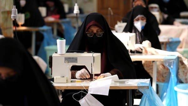 Iranian women, members of paramilitary organization Basij, make face masks and other protective items at a mosque in the capital Tehran. -- Courtesy photo