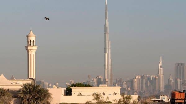 A mosque is seen in front of the world's tallest building Burj Dubai. -- File photo
