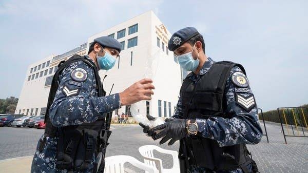 Kuwaiti special forces stand at the entrance of a quarantine facility in Fahaheel. -- File photo
