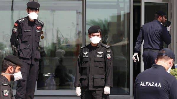 Qatari police stand outside a hotel in Doha where people have been quarantining over fears of coronavirus. -- File photo
