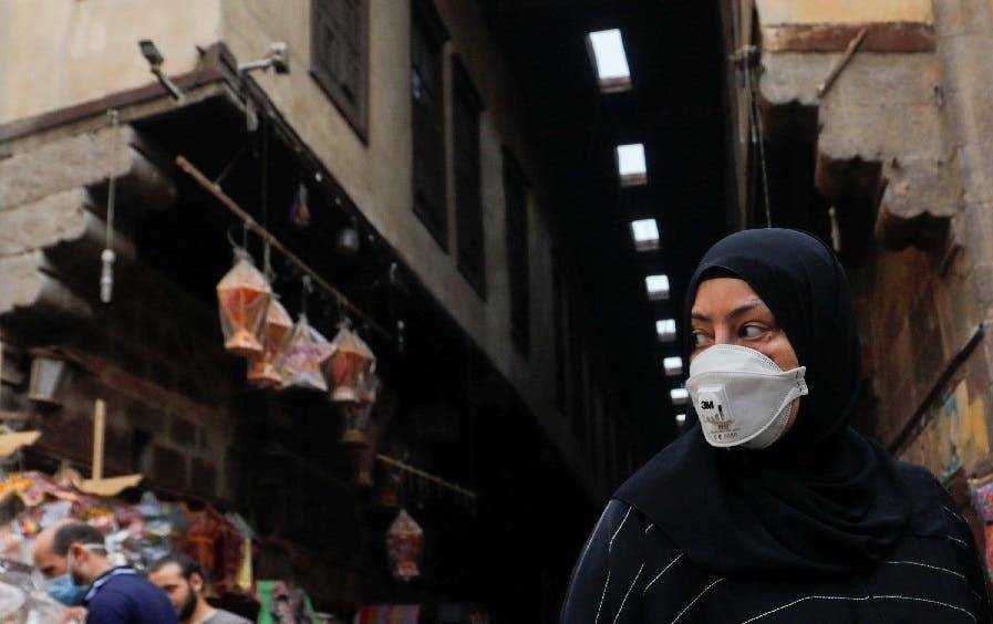 A woman wearing a protective face mask, amid concerns over the coronavirus, looks at traditional Ramadan lanterns, ahead of the Muslim holy month of Ramadan at Al-Khayamia Street in Old Cairo, Egypt. — Courtesy photo