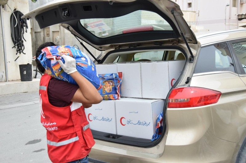 Bahraini Red Crescent volunteers have been deployed in small teams to distribute aid at different times of the day, wearing masks and gloves, and ensuring social distancing.