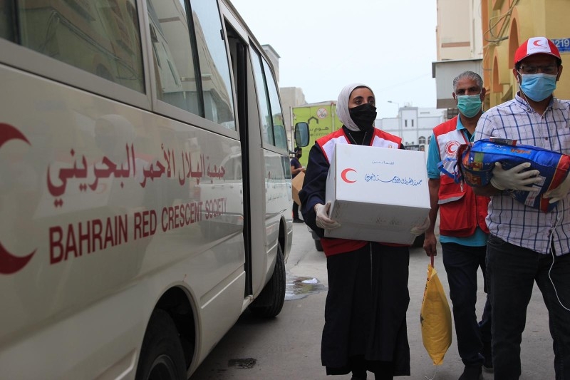 Bahraini Red Crescent volunteers have been deployed in small teams to distribute aid at different times of the day, wearing masks and gloves, and ensuring social distancing.