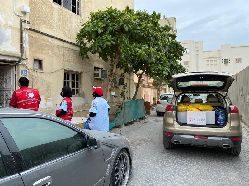 Bahraini Red Crescent volunteers have been deployed in small teams to distribute aid at different times of the day, wearing masks and gloves, and ensuring social distancing.