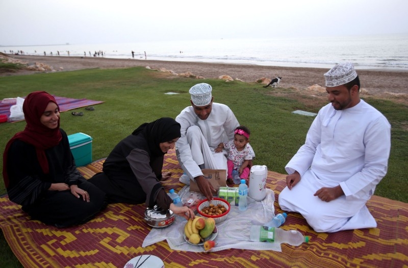 An Omani family gathers to break its fast at the beach in the capital Muscat in this June 17, 2016 file photo. — AFP