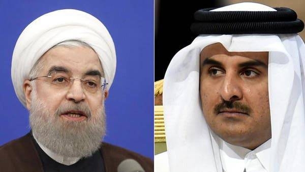 Iranian President Hassan Rohani and Qatari Emir Tamim Al-Thani. -- File photo
