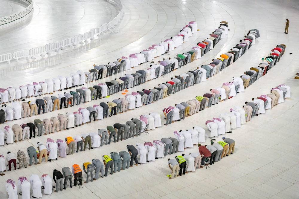 With restrictions in force for pilgrims, a number of the Haram Presidency officials and cleaning workers attend Ramadan prayers at the Grand Mosque in Makkah.