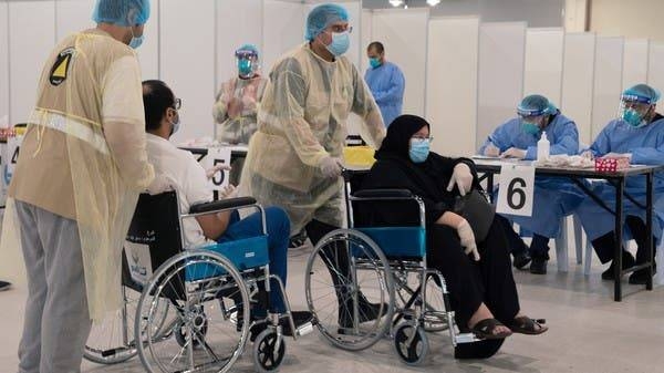 Volunteers help Kuwaitis, arriving from Europe, to undergo compulsory coronavirus test. -- File photo
