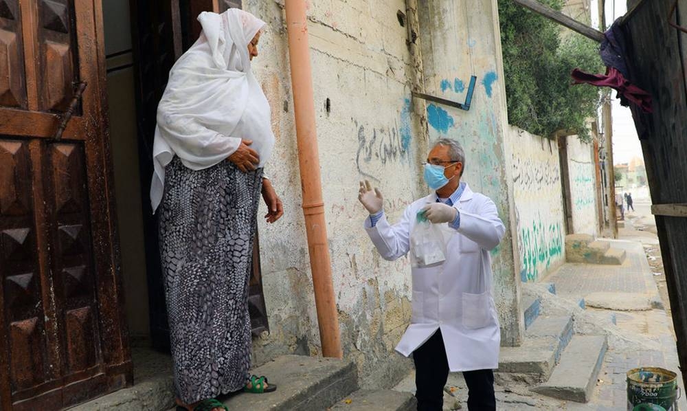 Health staff from the Shaboura Health Center in Rafah, Gaza, run by UN relief agency UNRWA, deliver medications directly to elderly Palestine refugees in the wake of COVID-19, so reduce their chances of exposure.