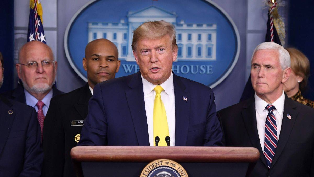 US President Donald Trump, center, speaks during a press briefing in White House as Vice President Mike Pence, right, looks on, in this file picture. — Courtesy photo