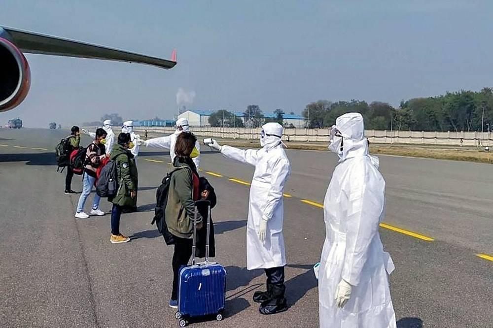 Passengers are being tested thermally prior to boarding the Air India flight.