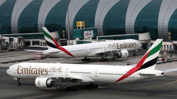 Emirates planes seen at Dubai International Airport. -- File photo
