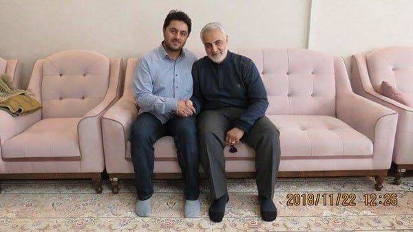 Abolfazl Sarlak, left, is pictured with slain IRGC Commander Qasem Soleimani. — Courtesy photo