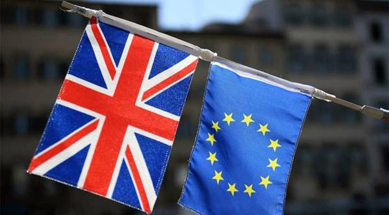 A Union Jack flag and an EU flag are seen in this file photo. The clock is ticking louder to the critical June 2 deadline and the chances of seeing a Brexit deal remain slim. 