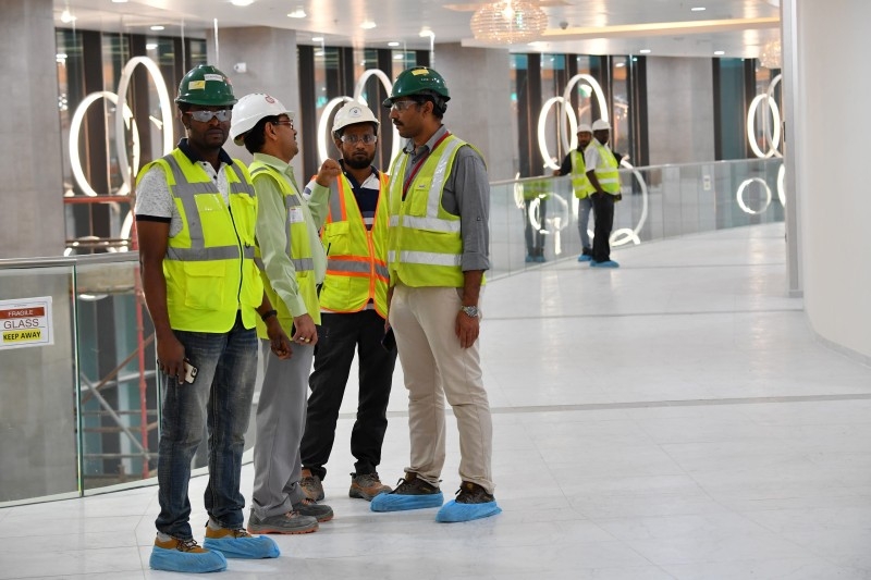 Construction workers seen inside Qatar's new Al-Bayt Stadium in the capital Doha, which will host matches of the FIFA football World Cup 2022.