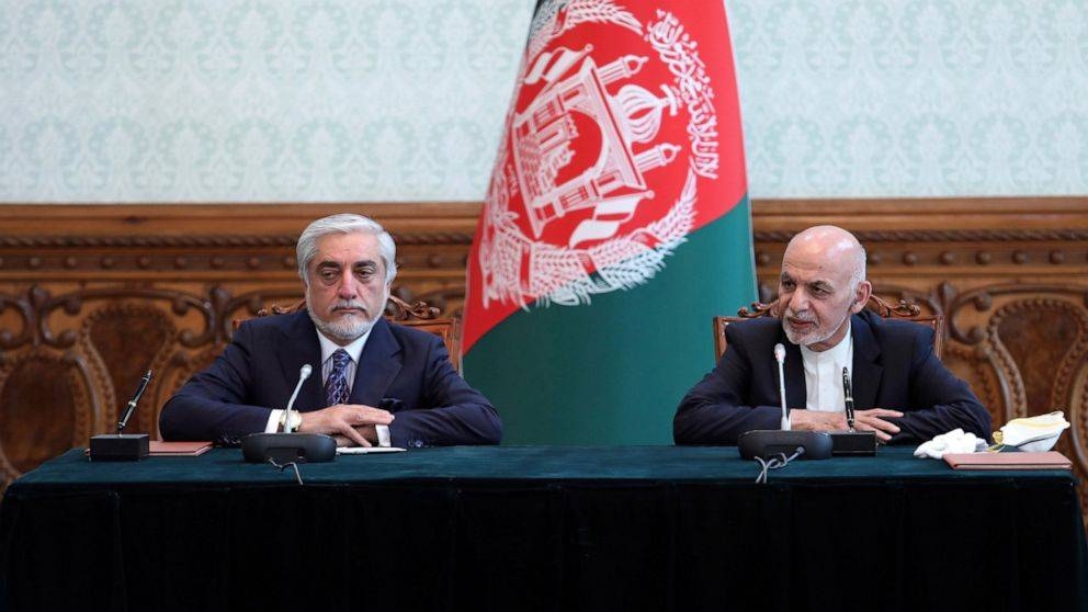 Afghan President Ashraf Ghani, right, and political rival Abdullah Abdullah are seen at the presidential palace in Kabul on Sunday. — Courtesy photo