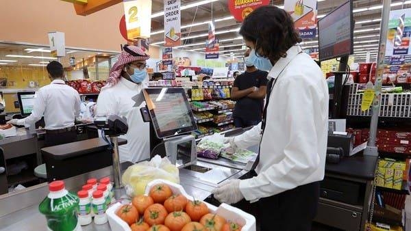 People wearing protective face masks and gloves shop at a supermarket in Riyadh. — Courtesy photo