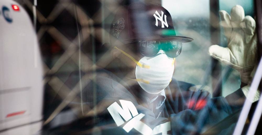 A bus driver in New York City wears a mask to protect himself against the Coronavirus. — courtesy UN Photo