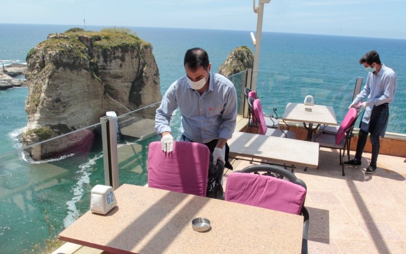 Cafe Em Nazih, a popular restaurant in Beirut, is shown full of patrons during a 2018 World Cup game. Now, compounding economic and coronavirus crises leave the restaurant facing an uncertain future, -- Courtesy photos

