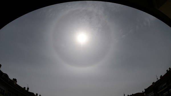 A halo, an optical phenomena from sunlight and ice crystals, forms around the sun above Cernusco sul Naviglio, near Milan, Italy, in this file picture. — Courtesy photo