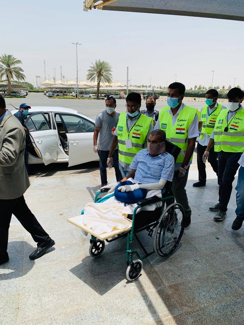KMCC volunteers are seen distributing PPE kits to passengers bound for India at King Abdulaziz International Airport in Jeddah.