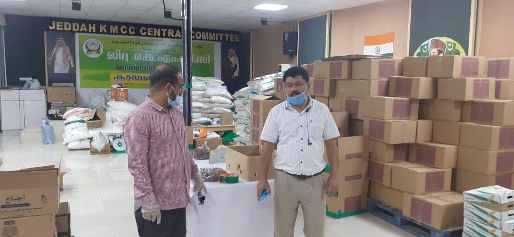 KMCC volunteers are seen distributing PPE kits to passengers bound for India at King Abdulaziz International Airport in Jeddah.