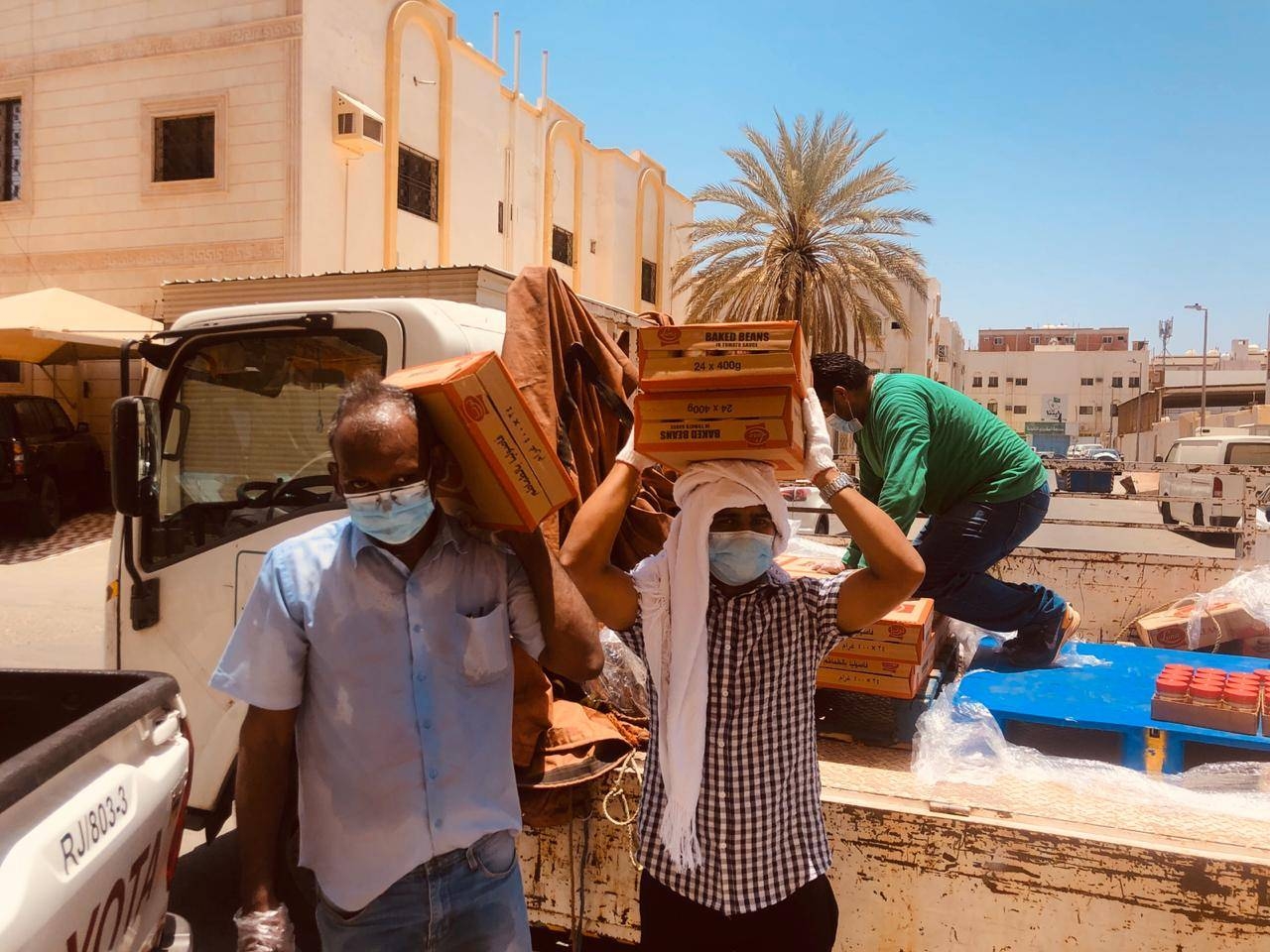 KMCC volunteers are seen distributing PPE kits to passengers bound for India at King Abdulaziz International Airport in Jeddah.