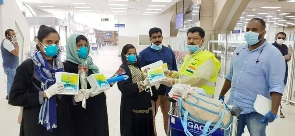 KMCC volunteers are seen distributing PPE kits to passengers bound for India at King Abdulaziz International Airport in Jeddah.