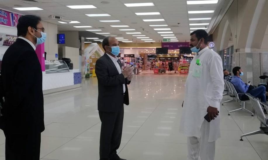 Passengers completing their procedures prior to departure from Jeddah in PIA flight to Faisaabad.