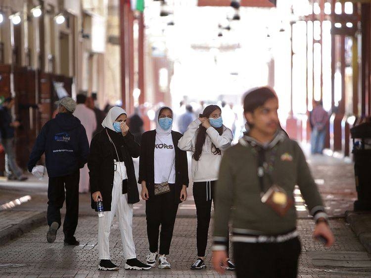 Women wear protective masks at the Mubarakiya Market in Kuwait City. -- Courtesy photo
