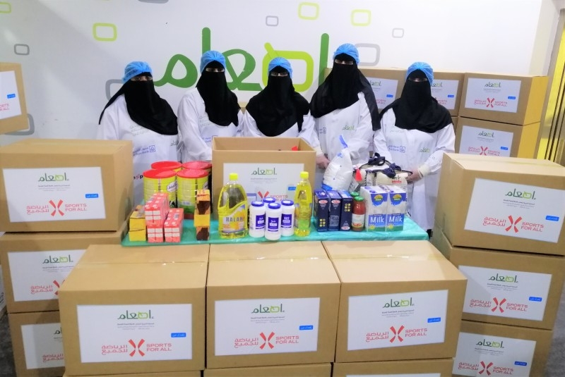 Women activists with collected goods.