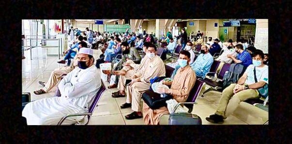 Pakistan nationals wait for their flights. 