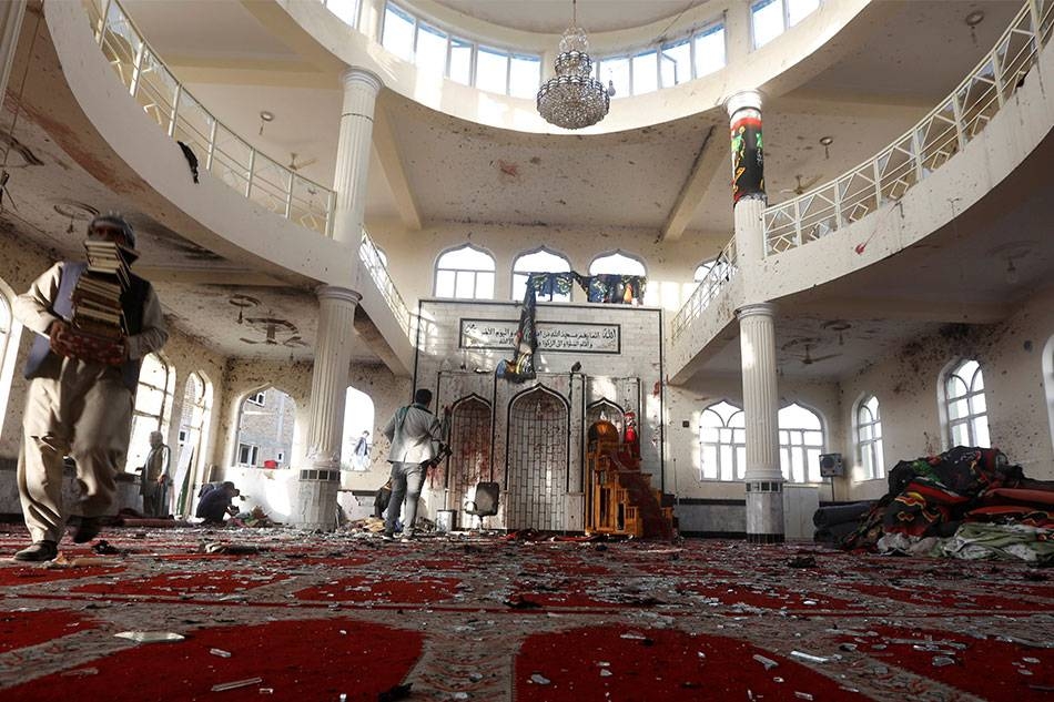 Afghan men inspect inside a mosque after a terror attack in Kabul in this file picture.