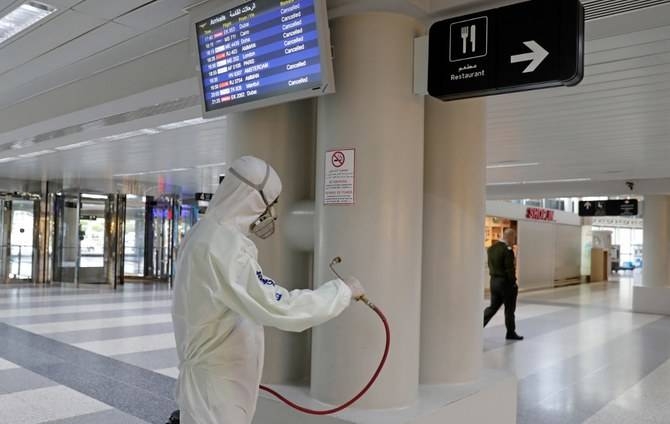 An employee of a private company sprays the interior of  Beirut international airport with disinfectant, to limit the spread of the Covid-19 coronavirus. — Courtesy photo 