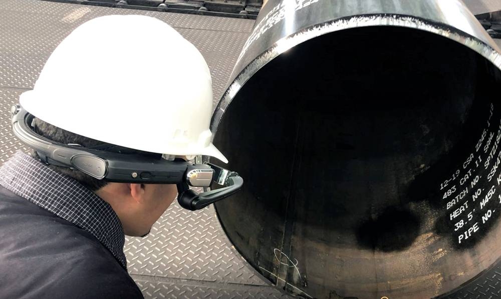 Smart helmet technology, as worn by this engineer, enables engineers to inspect materials remotely to minimize people gathering while ensuring sustainability of company operations amid the COVID-19 pandemic.